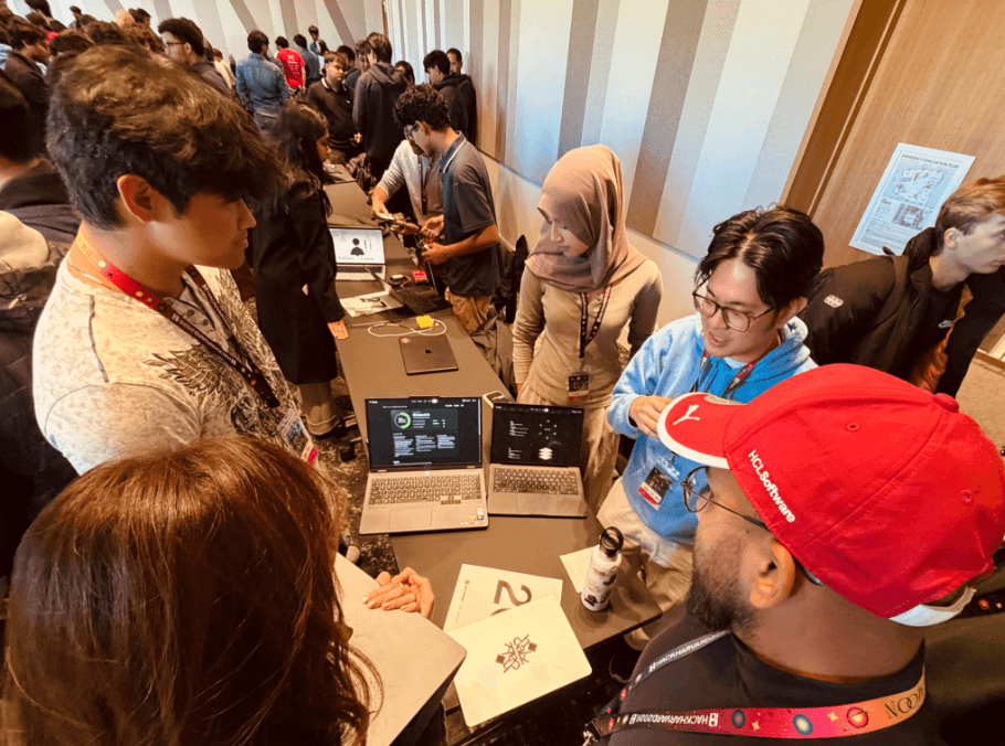 Students crowd the Chalk table at HackHarvard 2026.